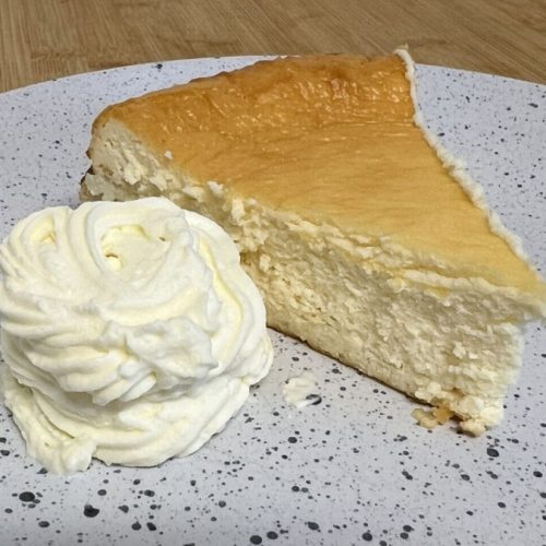 baked carnivore cheesecake with whipped cream