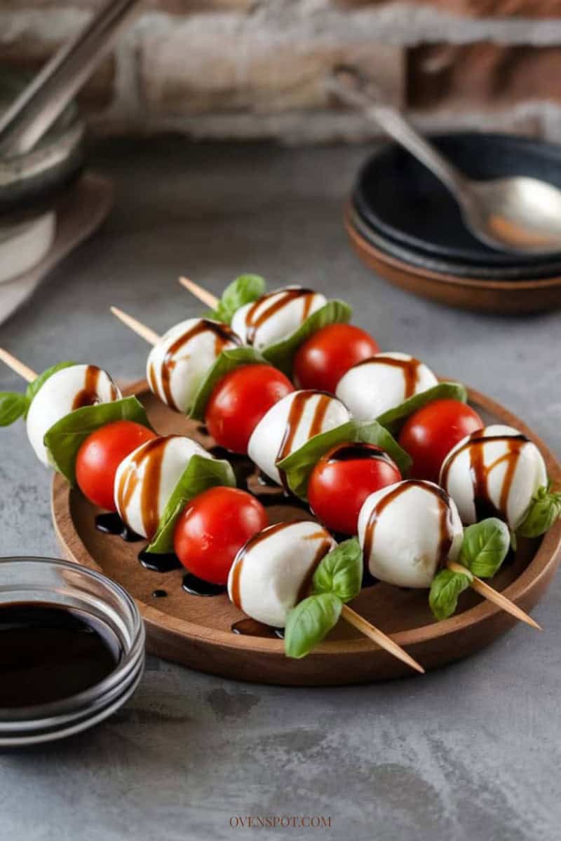 Caprese skewers with tomato, mozzarella, basil, and balsamic glaze