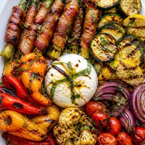 grilled vegetable platter with a variety of vegetables bacon and cheese